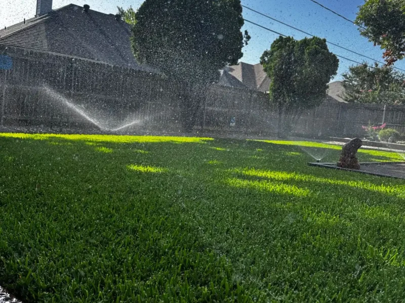 Added sprinkler heads giving full coverage across a green lawn