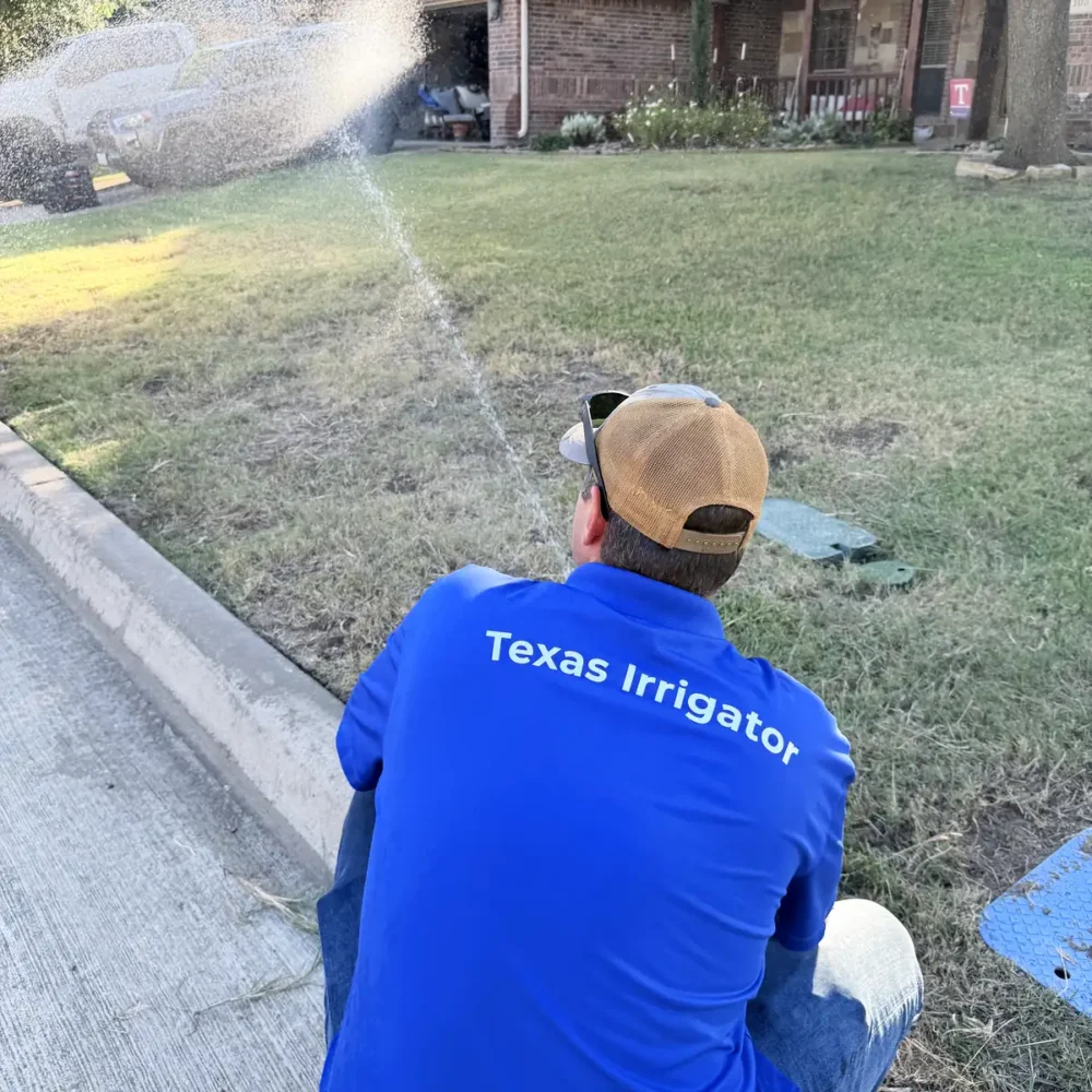 Technician adjusting a rotor head while it runs along the curb